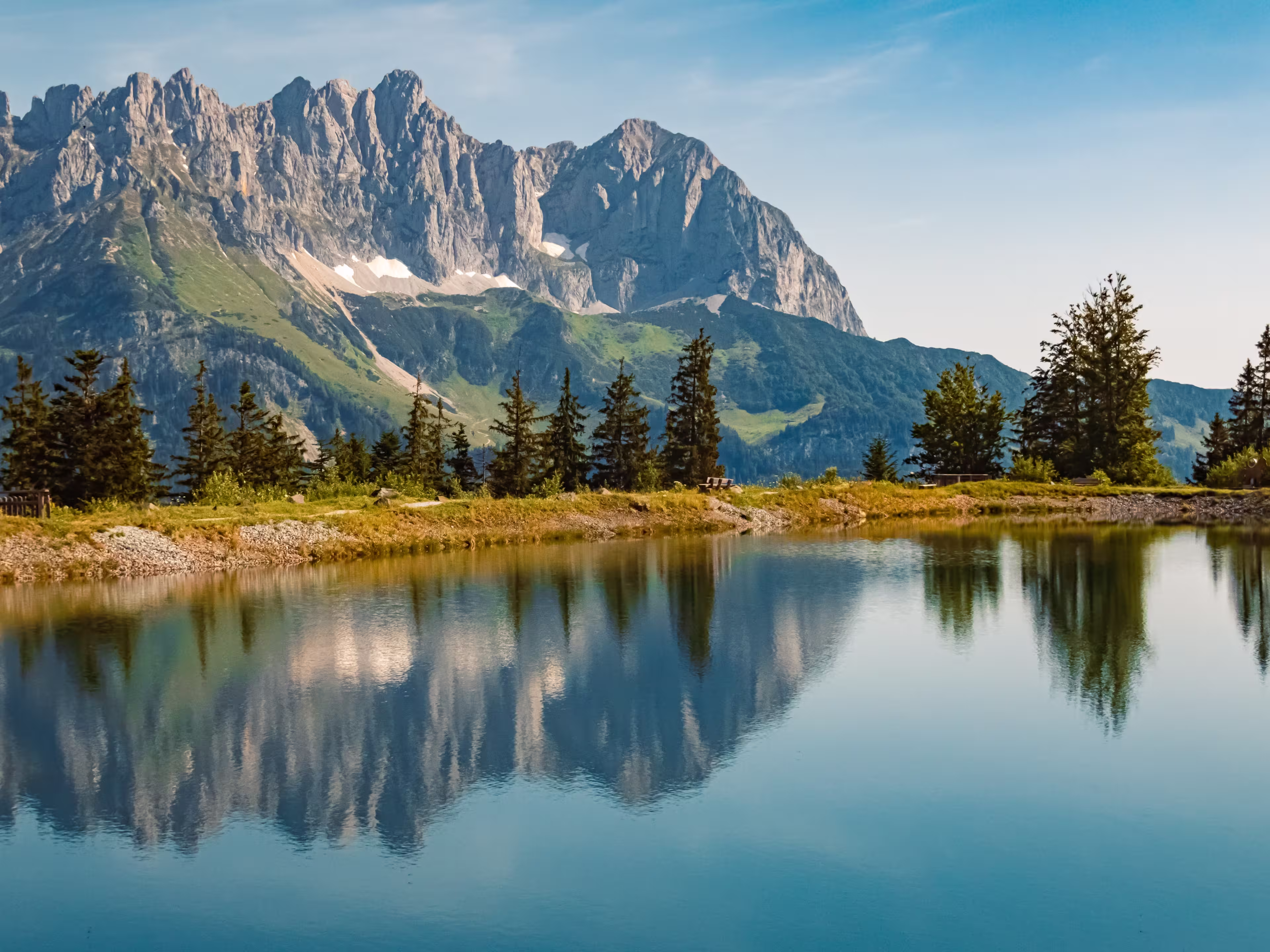 Alpine summer view with reflections and Mount Wilder Kaiser at Mount Astberg, Going, Kitzbuehel, Tyrol, Austria