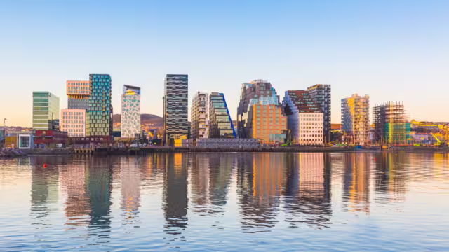 Modern buildings in Oslo, Norway, with their reflection into the water. These are some of the new buildings in the neighbourhood of Bjorvika. Concepts of travel and architecture.