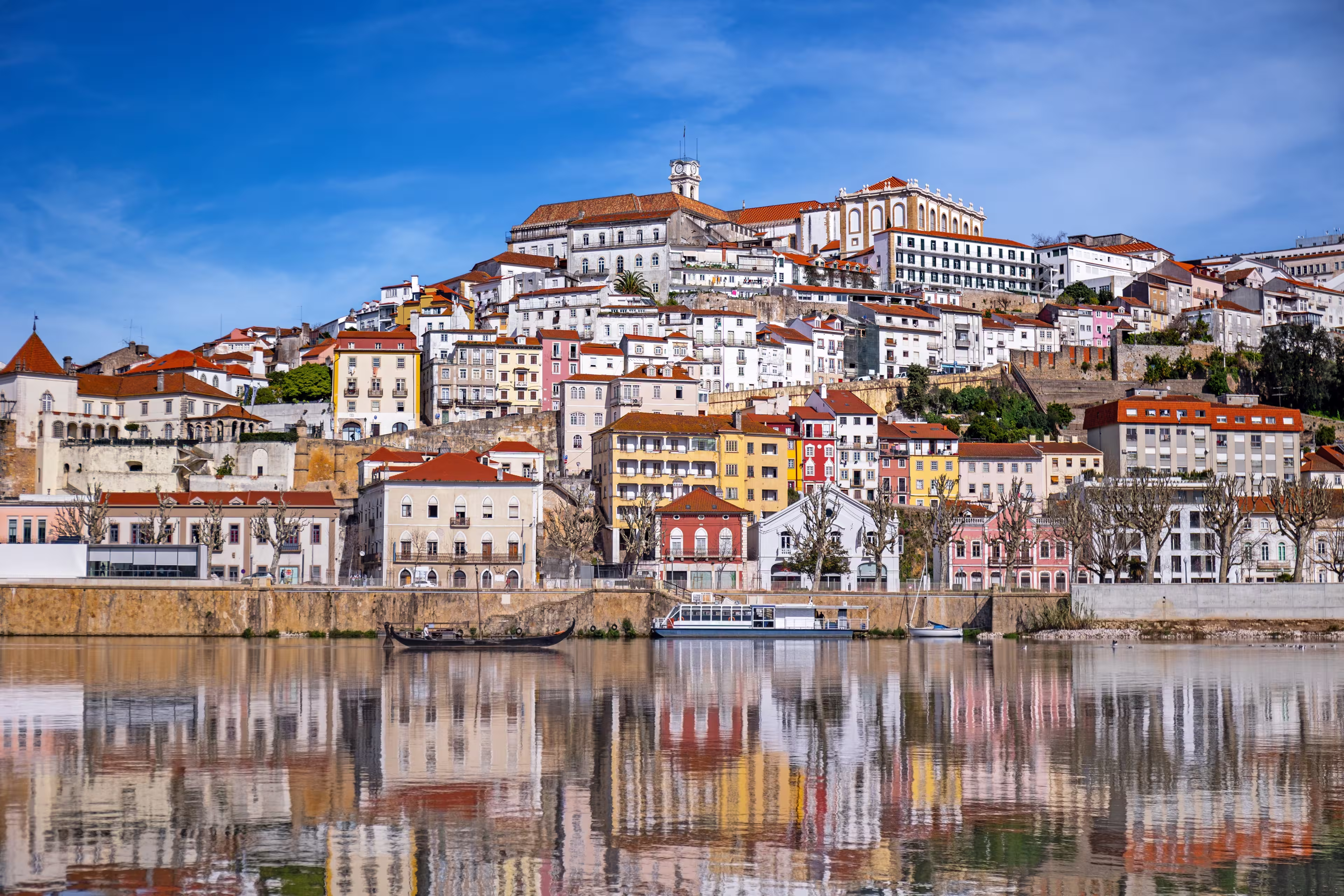A picturesque panorama of Coimbra with the reflection in the Mondego river