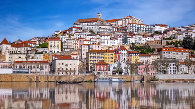 A picturesque panorama of Coimbra with the reflection in the Mondego river