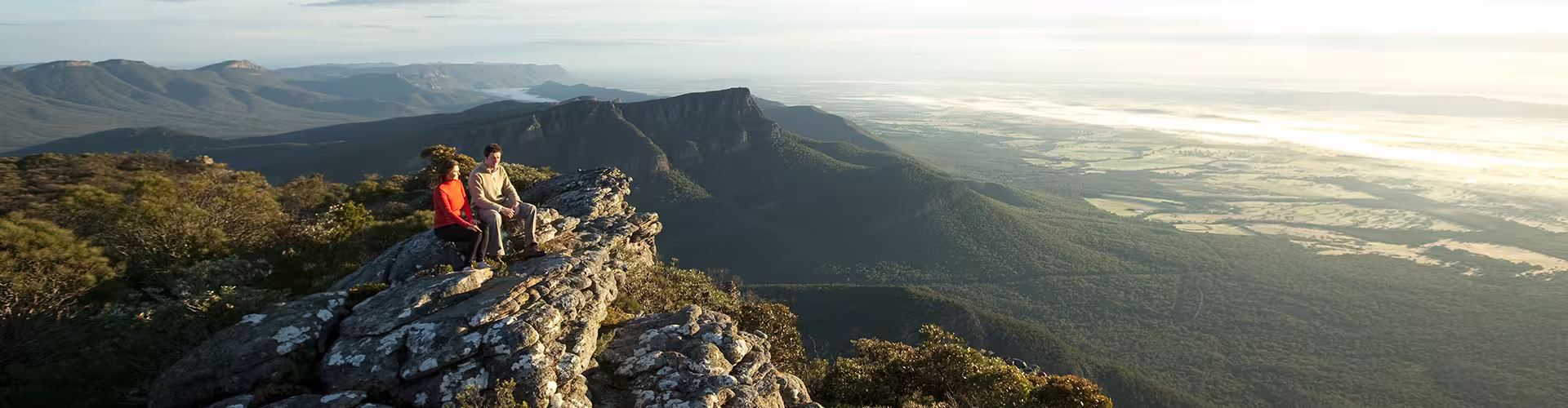 Travellers sitting on Baronia Peak in Grampians National Park, Victoria