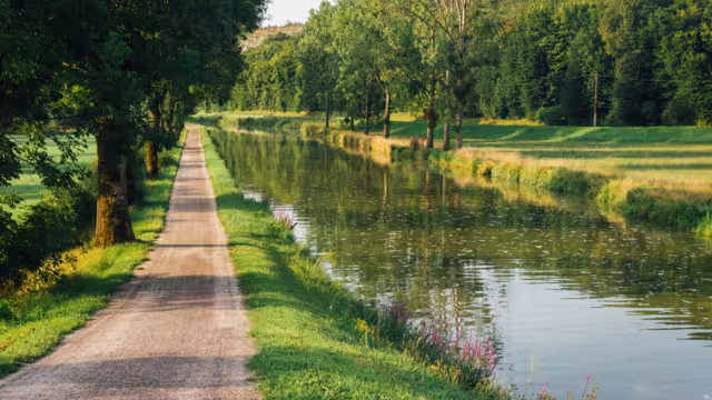 Towpath on the Burgundy canal. Hiking trail. Holiday route.