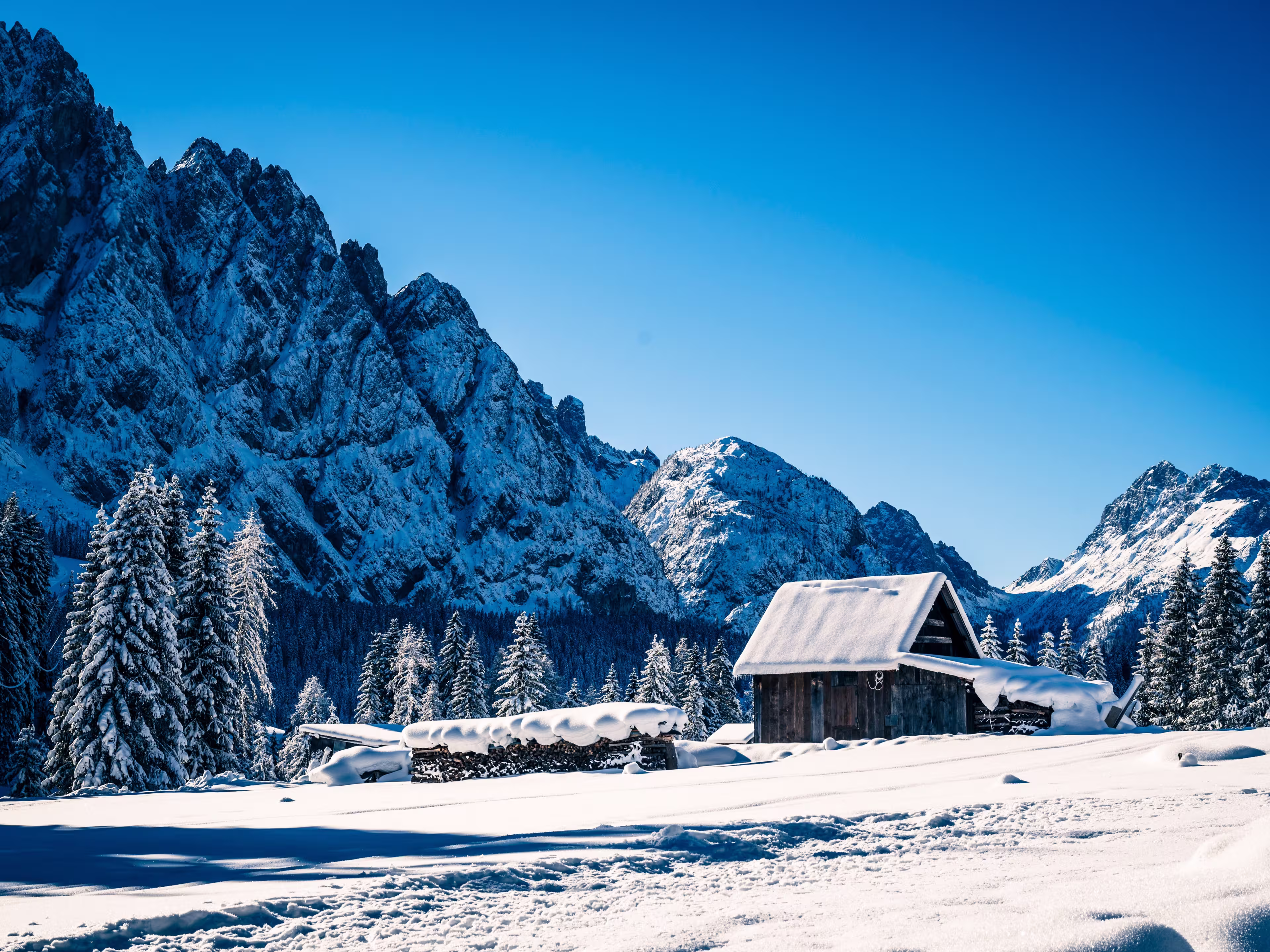 Ice Dawn in Sappada. Walk through ancient villages and dream mountains. Dolomites.