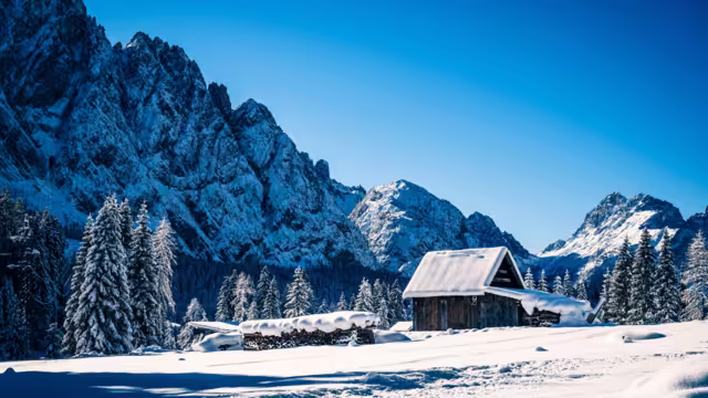 Ice Dawn in Sappada. Walk through ancient villages and dream mountains. Dolomites.