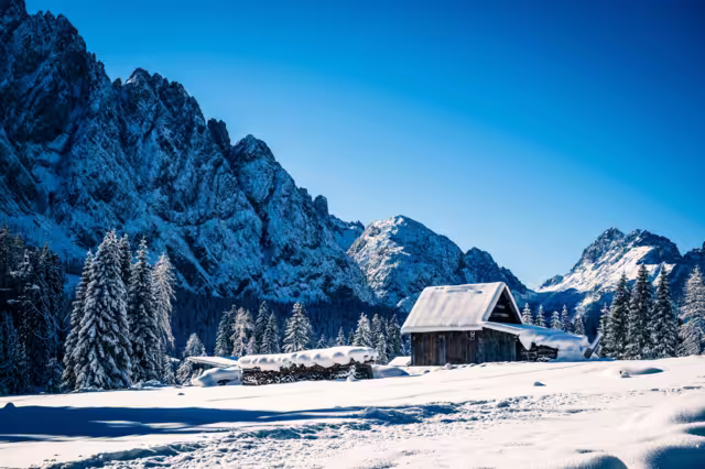 Ice Dawn in Sappada. Walk through ancient villages and dream mountains. Dolomites.