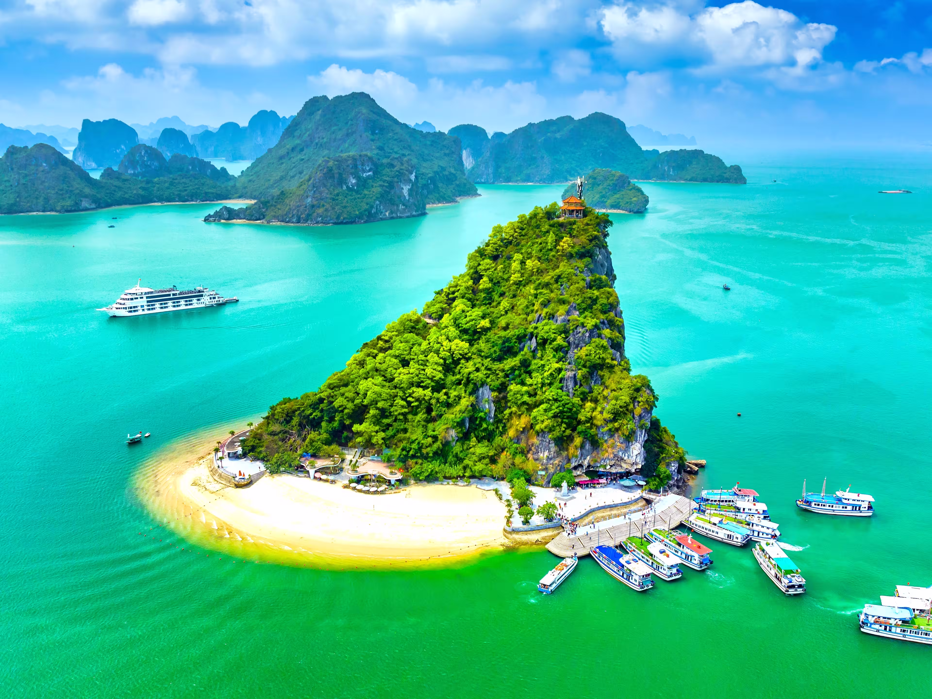 Aerial view of Ha Long bay during daytime beautiful emerald green water. This is the UNESCO World Heritage Site, a beautiful natural wonder in northern Vietnam, Southeast Asia nature background.