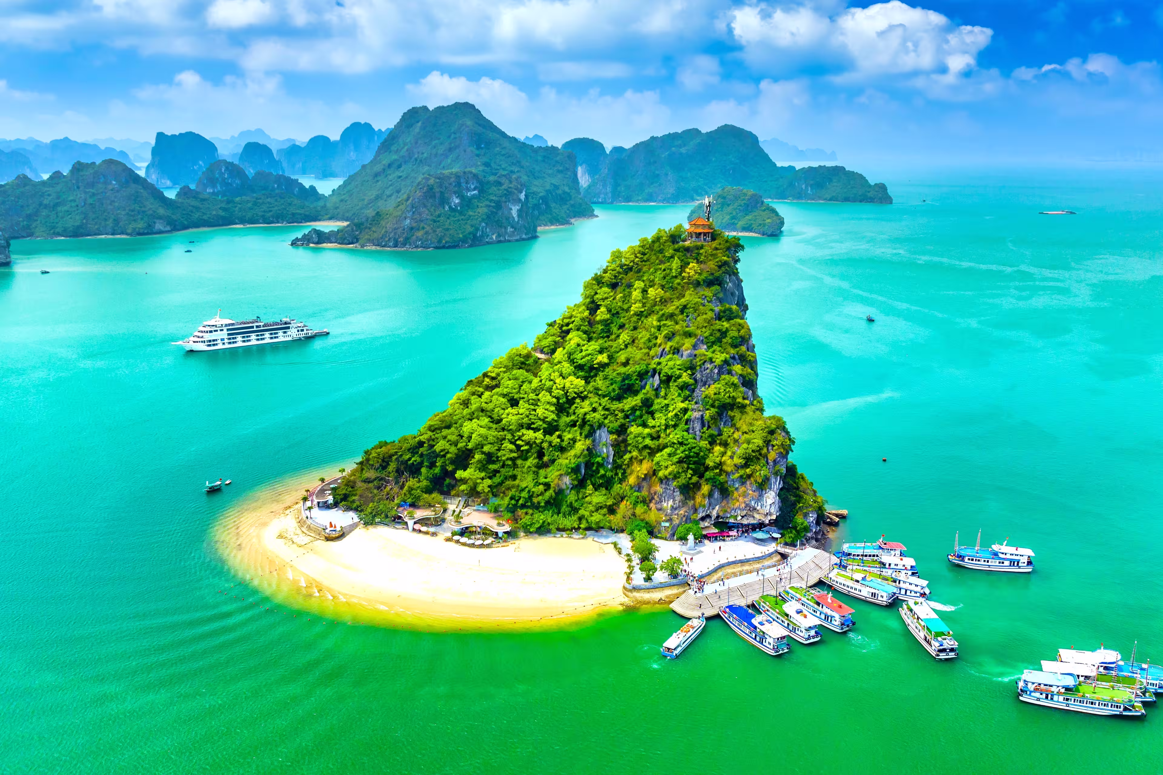 Aerial view of Ha Long bay during daytime beautiful emerald green water. This is the UNESCO World Heritage Site, a beautiful natural wonder in northern Vietnam, Southeast Asia nature background.
